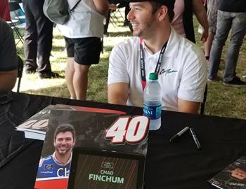Chad Finchum signing autographs at Mid-Ohio.