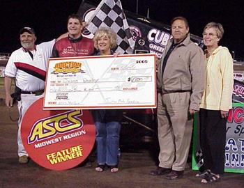 Jason Danley takes the winners check