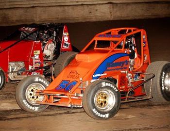 Charles Davis, Jr., (50) races with Brandon Lane (97)