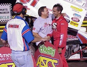 Darren Stewart is greeted in victory lane by his father, Mike Stewart