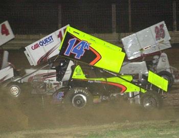 Cars scramble after Kyle Bellm (14k) gets turned around in the feature