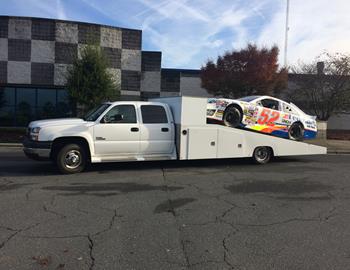 Ken, our crew chief Donnie, and the Federated Auto Parts race car on the way to Staunton for an open house! 