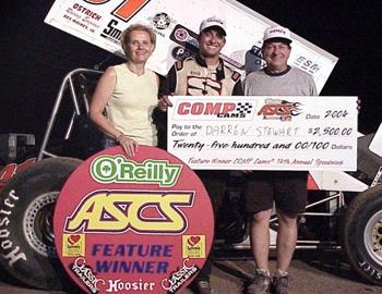 Darren Stewart is joined by his parents in victory lane