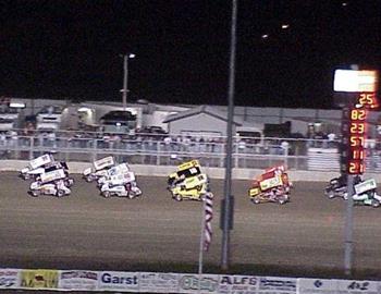 Three-wide down the backstretch