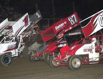 Brian McClelland (87) races with his brother, Sean McClelland (1), through lapped traffic