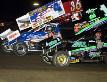 Sean McClelland (1), Toby Brown (4m) and Jason Martin (36) in three-wide racing action at Oklahoma City