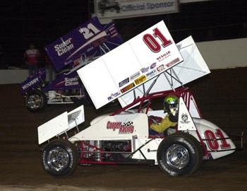 Gary Wright (01) chases Brian Brown (21) in heat race action