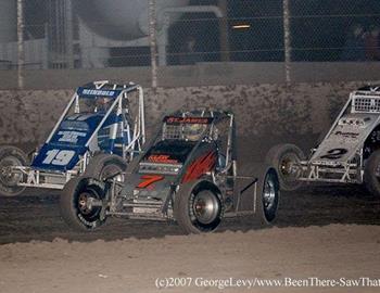 Bruce St. James (7k) leads Andrew Reinbold (19) and Michael Colegrove off the corner