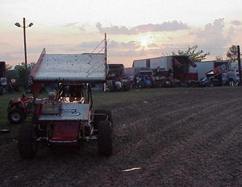 The sun sets over the Riverside Speedway pit area.