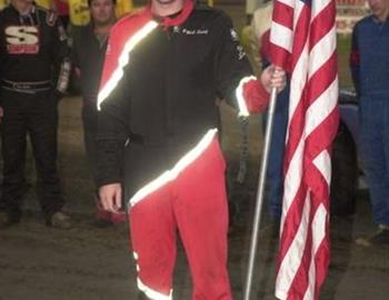 Nick Smith holds the Flag during opening ceremonies