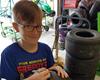 Shell Shocked Racing Driver Signs Tire for Fan