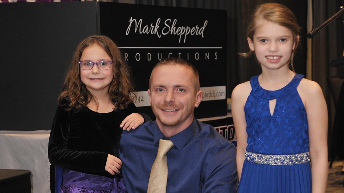 Josh Weller poses with trophy assistants Aubrey Weller and Madison Michael