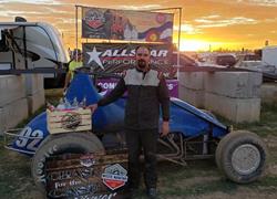 PEARCE RACES TO FIRST-PLACE WITH W