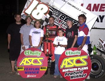 Tony Bruce, Jr., and company in victory lane at I-90 Speedway