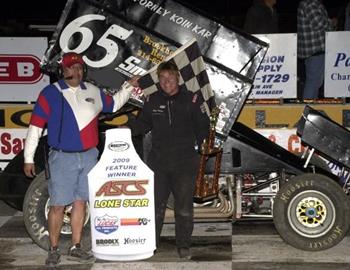Skip Wilson wins the inaugural ASCS feature by reaching victory lane at Wacos Heart O Texas Speedway