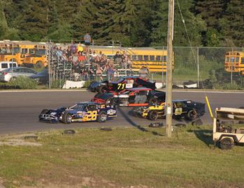 #79 of Roddy Bolduc split #83 Sean Sykes and #71 Jay McCoy down the backstretch making it three wide into corner 3.  McCoy ended up over the bank and into the tires near the track entrance on corner 4 